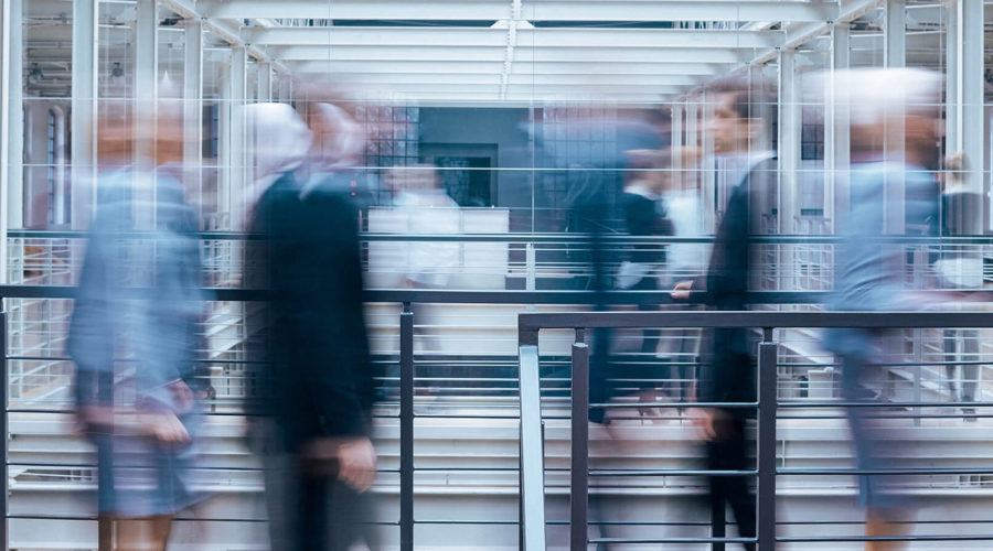 business-people-talking-in-corridor-PSVCLEM(1)